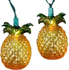 two yellow pineapple shaped lights are on a white background