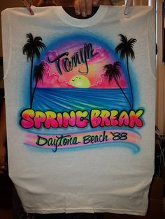 someone holding up a t - shirt with the words spring break daytona beach on it