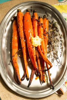 carrots with butter and herbs on a plate