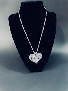 Sterling silver 3 D filigree puffy heart with a 24" twirled rope chain. The heart is a combination of leaves, flowers and vines. This  perfect gift will be carefully packed and promptly shipped with insurance. Send measage if you would like it  gift wrapped or message included. Elegant Metal Heart Necklace With Silver Chain, Silver Heart Wedding Necklace, Valentine's Day Heart Pendant Jewelry With Silver Chain, Valentine's Day Heart Pendant Silver Chain Jewelry, Valentine's Day Heart Pendant With Silver Chain, Silver Jewelry With Large Pendant For Valentine's Day, Valentine's Day Silver Jewelry With Large Pendant, White Gold Filigree Heart Jewelry, Valentine's Day Heart Pendant Silver Necklace