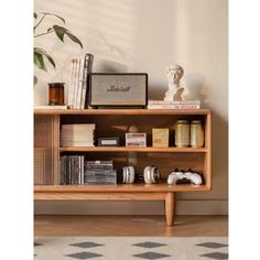 a wooden shelf with books and other items on it