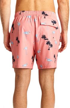 An easy and fun flamingo print defines smart swim trunks cut from stretchy quick-drying fabric. 24" leg opening; 6" inseam (size M) Elastic drawstring waist Side pockets All-over print Woven 92% polyester, 8% spandex Machine wash cold, tumble dry low Imported Model stats: 6'1" height, 32" waist. Model is wearing size M. Graphic Print Beach Bottoms For Vacation, Summer Vacation Bottoms With Graphic Print, Graphic Print Bottoms For Beach Vacation, Printed Patterned Bottoms For Beach Season, Summer Vacation Graphic Print Bottoms, Casual Beach Bottoms With Graphic Print, Casual Graphic Print Beach Bottoms, Casual All Over Print Bottoms For Summer, Casual Pink Bottoms With Graphic Print