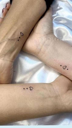 two people with matching tattoos on their legs