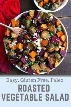 roasted vegetable salad with feta cheese in two white bowls on a wooden table top