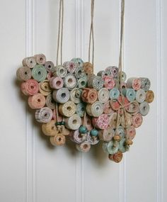 there is a heart made out of donuts hanging on the door handle and string