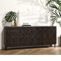 the sideboard is made out of wood and has an intricate design on it's sides