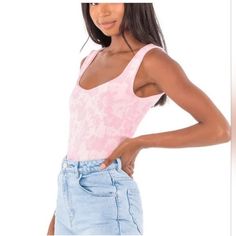 Bring Some Flair To Your Wardrobe With This Free People Clean Lines Bodysuit In Bubble Bath Combo. With A Comfortable Fit, This Medium-Large Tank Is Perfect For Casual Occasions. The White-Pink Color Combination And Basic Style Make This Bodysuit A Versatile Addition To Your Collection. Made From Polyester, Spandex And Nylon, This Lined Bodysuit Is Both Durable And Stylish. The Free People Brand Adds A Touch Of Sophistication To This Piece. Whether You're Dressing Up Or Down, This Bodysuit Is Su Summer Pink Bodysuit With Scoop Neck, Spring Pink Seamless Bodysuit, Pink Seamless Bodysuit For Spring, Casual Scoop Neck Bodysuit For Spring, Casual One-piece Top For Summer, Casual One-piece Tops For Spring, Pink Color Combination, Free People Romper, Free People Bodysuit