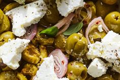 olives, feta cheese and herbs in a baking dish