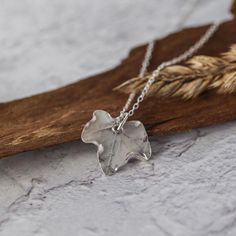 Handmade silver baby Ivy leaf Pendant on a delicate sterling silver trace chain.  This cute Silver Leaf Necklace is made by hand from a real leaf using '999' fine silver. This would make the perfect Christmas gift for a nature lover & is eco friendly too as Fine Silver is a recycled material. Ivy symbolises eternity, fidelity, and strong affectionate attachment, so would make the perfect gift for a loved one! Pendant length 1.5cm & is supplied on a sterling silver trace chain, please choose whic Leaf Jewellery, Real Leaf, Ivy Leaf, Leaf Jewelry, Leaf Necklace, Leaf Pendant, Gifts For Nature Lovers, Gift Handmade, Silver Leaf