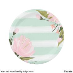 a paper plate with pink flowers and green leaves painted on the front, along with stripes in the background