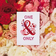 a card with the words one and only on it surrounded by pink, red and white flowers