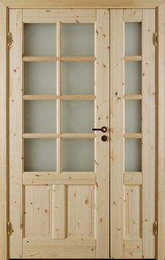 a wooden door with glass paneling on the front and side panels in light wood