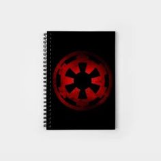 a spiral notebook with the symbol of star wars on it