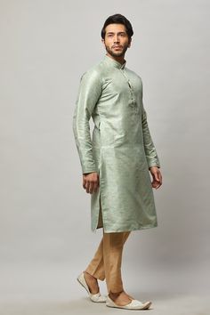 Brocade Kurta with gold embossing & placket plus gold churidar Crafted with a collar neckline, full sleeves, and front button closure. Occasion: Can be worn to lighter events like Sangeet, Mehendi, Puja, or a small party WASH CARE INSTRUCTIONS - Please Dry clean only when it is applicable. Slight color variation is possible due to digital photography. Green Long Sleeve Churidar For Eid, Semi-formal Straight Kurta With Resham Embroidery, Pista Green Churidar With Zari Work And Long Sleeve, Semi-formal Long Sleeve Sets For Diwali, Festive Straight Kurta For Semi-formal Occasions, Festive Semi-formal Straight Kurta Traditional Wear, Semi-formal Long Sleeve Kurta For Diwali, Elegant Long Sleeve Kurta With Zari Weaving, Green Long Sleeve Traditional Wear With Zari Weaving