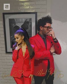 a man in a red suit talking on a cell phone while standing next to a woman