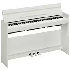 a white piano sitting on top of a table