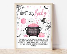 a framed poster with the words, don't say baby on it and two white cats in a caulder