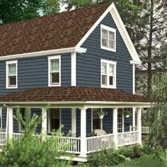 a blue house with white trim and brown roof