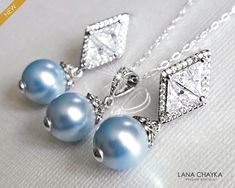 Wedding Light Blue Blush Baby Blue Colored Pearl Silver Earrings and Necklace Bridal Jewelry Set with .925 Sterling Silver Chain. CHAIN is 18 inches (45.7cm) long. EARRINGS are about 1.18 inch (3cm) long from top of earring stud to bottom. PENDANT is about 0.90 inch (2.3cm) long including bail. BRIDAL BRACELET SECTION: https://www.etsy.com/shop/LanaChayka?ref=seller-platform-mcnav§ion_id=11638942 BRIDAL EARRINGS SECTION: https://www.etsy.com/shop/LanaChayka?ref=seller-platform-mcnav§ion_id=11638940 BRIDAL JEWELRY SETS SECTION: https://www.etsy.com/shop/LanaChayka?ref=seller-platform-mcnav§ion_id=25839214 BRIDAL NECKLACES SECTION: https://www.etsy.com/shop/LanaChayka?ref=seller-platform-mcnav§ion_id=11638944 Elegant and classy, this stunning jewelry set is perfect for weddings or special oc Blue Pearl Jewelry, Blue Pearl Earrings, Blue Wedding Jewelry, Pearl Jewelry Set, Pearl Bridal Jewelry, Silver Pearl Earrings, Pearl Jewelry Wedding, Pearl Jewelry Sets, Necklace Bridal