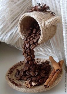 coffee beans are spilling out of a cup