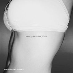 a woman's stomach with the words love yourself first written on her left side