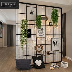 a living room filled with lots of plants and decorations on the wall next to a window