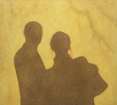 the shadow of two people standing next to each other in front of a yellow wall