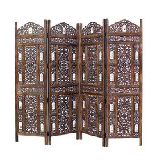 an ornate wooden room divider with intricate carvings