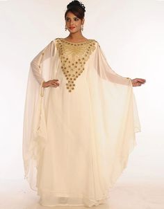 ❤️Inshallah❤️ Trendy Off White Georgette Hand Embroidery Party Wear Kaftan 👗 Order Online latest Embroidered Kaftan which are made up from best quality fabrics with latest styles from our large collections at arabicattire.com Shop Now : https://bit.ly/3Q59Xdo Buy online @ $71.5 #eveningkaftans #arabicapparel #middleeasternclothingonline #islamickaftan #fittedkaftandresses #longkaftandressesonline #dressykaftans #islamicclothingforsale #middleeastclothingforwomen Middle East Clothing, Kids Kaftan, Modest Evening Dress, Zari Embroidery, Long Kaftan, Georgette Dress, Hooded Dress, Islamic Clothing, Zari Work