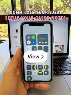 a person holding an iphone in front of a laptop with the caption view > don't lose your idea setup your quick notes
