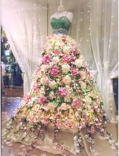 a dress made out of flowers on display