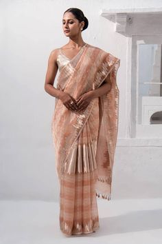 Peach handloom banarasi saree with stripe pattern in zari work. Comes along with unstitched blouse piece. - Aza Fashions Traditional Blouse With Woven Motifs For Festive Occasion, Festive Woven Motifs Blouse, Elegant Blouse Piece With Weaving Work For Puja, Elegant Blouse Piece For Puja With Weaving Work, Elegant Blouse Piece With Woven Motifs For Festive Occasions, Elegant Festive Blouse Piece With Woven Motifs, Pre-draped Saree With Weaving Work For Puja, Slub Silk Saree With Woven Motifs For Wedding, Traditional Drape Blouse With Woven Motifs