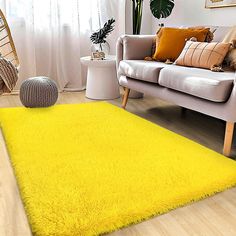 a bright yellow area rug in a living room