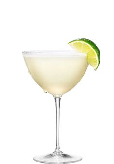 a margarita with a lime wedge on the rim in a coupe glass against a white background