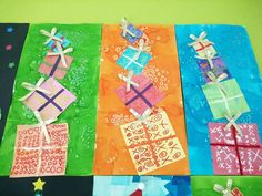 four different colored paper wrapped presents on a table