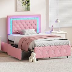 a bedroom with pink bed, nightstands and white carpeted flooring in front of a window