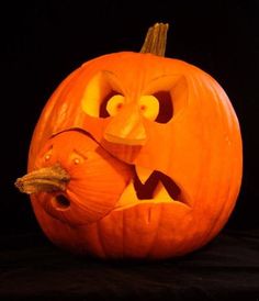 a carved pumpkin with an angry face on it