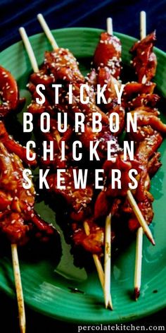 chicken skewers on a green plate with the words sticky bourbon chicken skewers