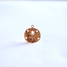 Shiny Vermeil Gold Sand Dollar- 18k gold over Sterling Silver Sand dollar charm, Gold starfish charm Gold Jewelry With Flower Charm For Beach, Gold Beach Jewelry With Flower Charm, Gold Flower Charm Pendant, Gold Pendant Flower Charm, Gold Pendant Charm With Flower Detail, Gold Pendant Jewelry With Starfish Charm, Gold Sand, Sand Dollar, Black Rhodium