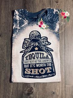 a t - shirt with an image of a bottle on it