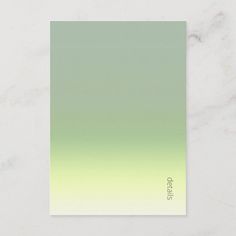 a green and yellow ombreed business card on a marble surface with the word stop