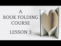 an open book with the words a book folding course lesson 2 on top of it