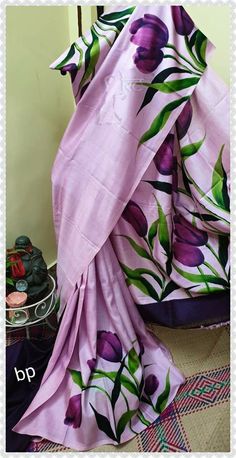 a purple and green floral print sari