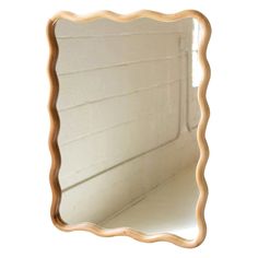 an image of a mirror that is on the wall in front of a white background