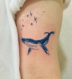 a blue whale tattoo on the right thigh