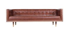 a brown leather couch sitting on top of a wooden frame