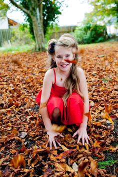 Bridesmaid in woods playing with autumnal leaves. Check out their Halloween and Rockabilly inspired wedding for more inspiration on fashion, table centres, decor, kill booth and more! Sleeveless Dress