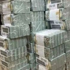 stacks of money are stacked on top of each other in a warehouse or storage room