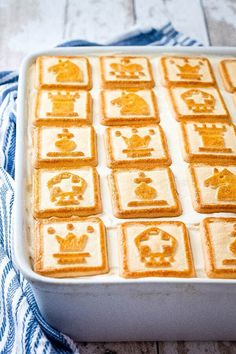 a pan filled with food on top of a blue and white towel