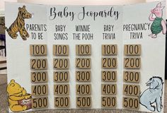 a baby shower board with winnie the pooh and tiwa on it's side